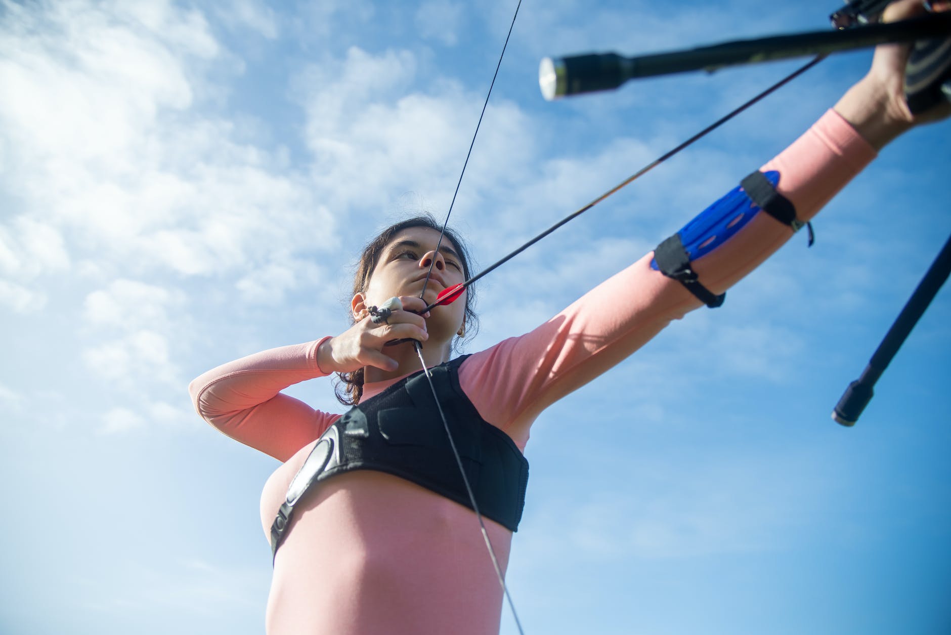 a woman using a recurve bow