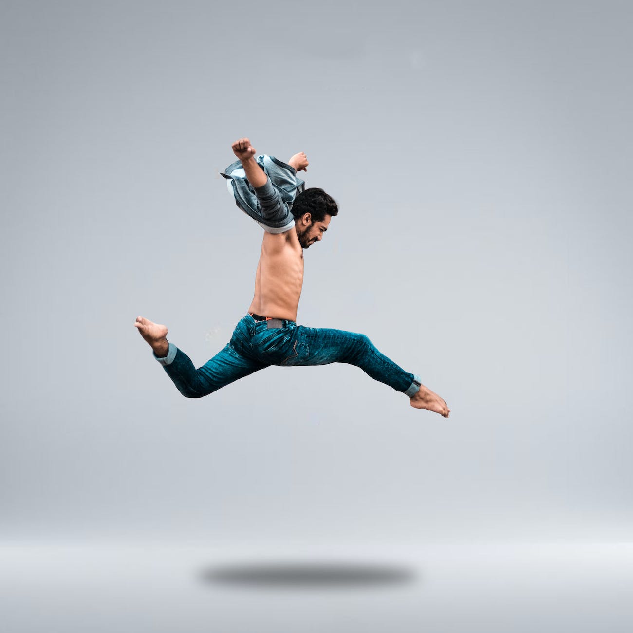 man jumping high while posing
