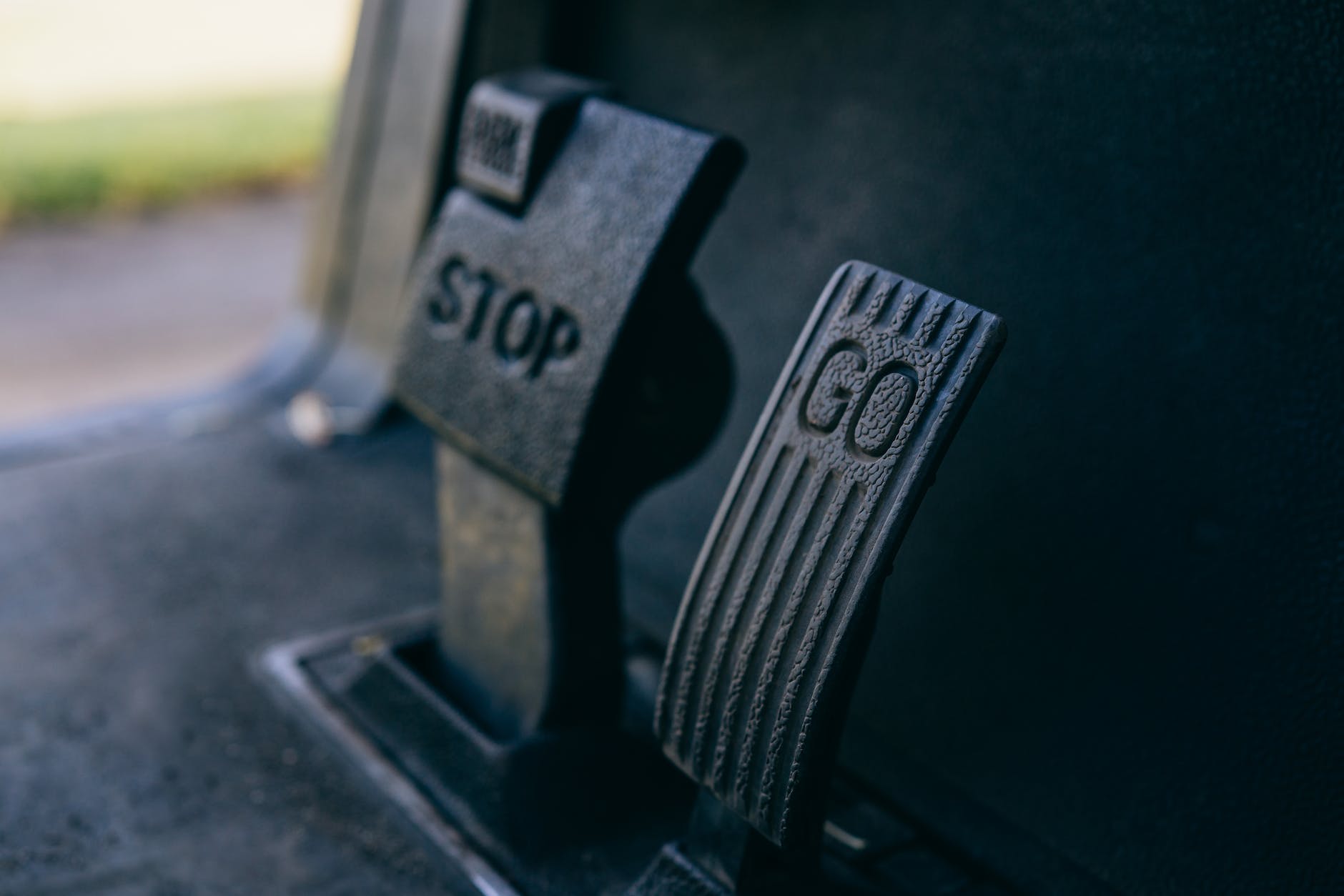 a close up shot of golf cart pedals