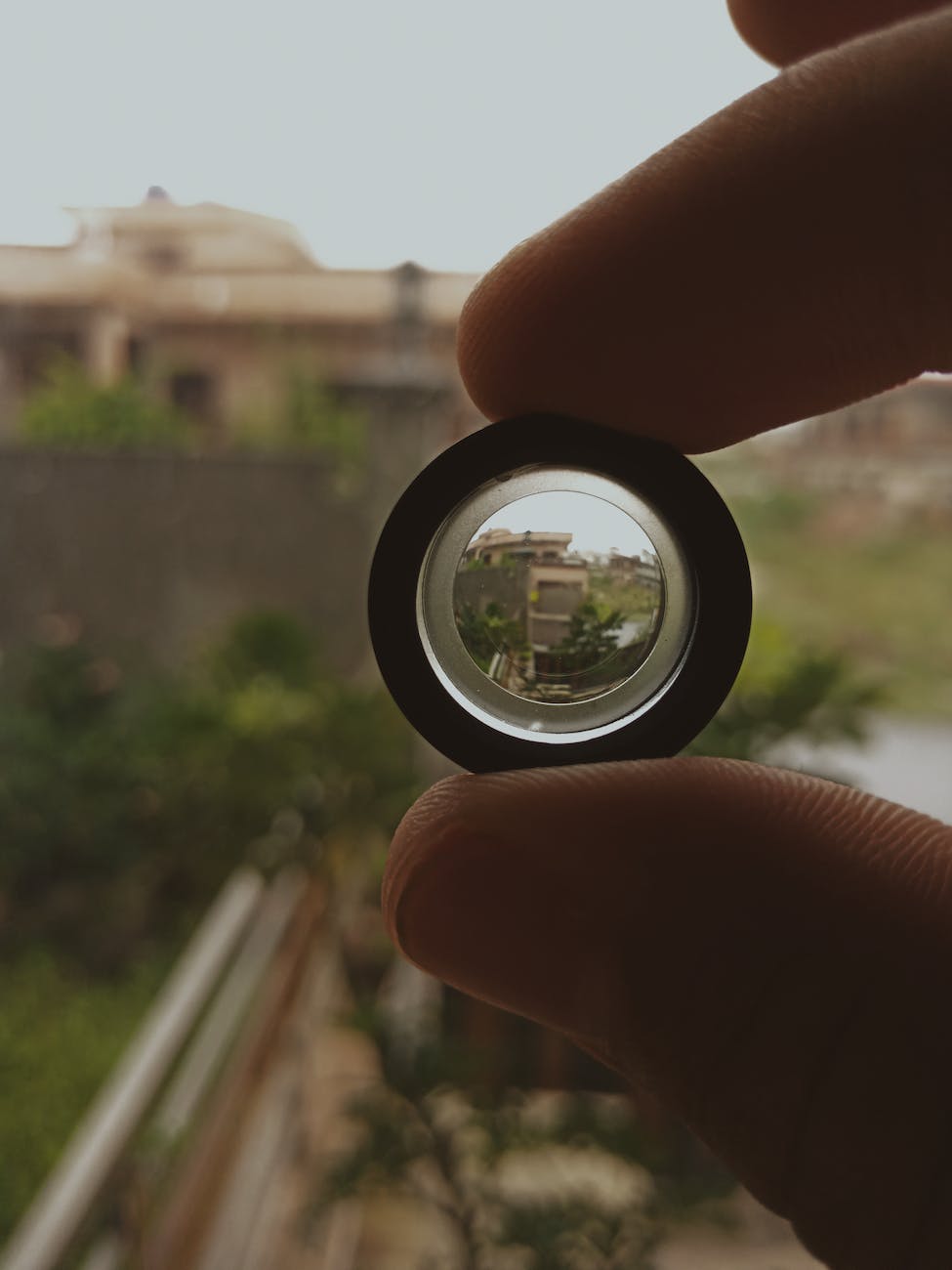 person holding black lens